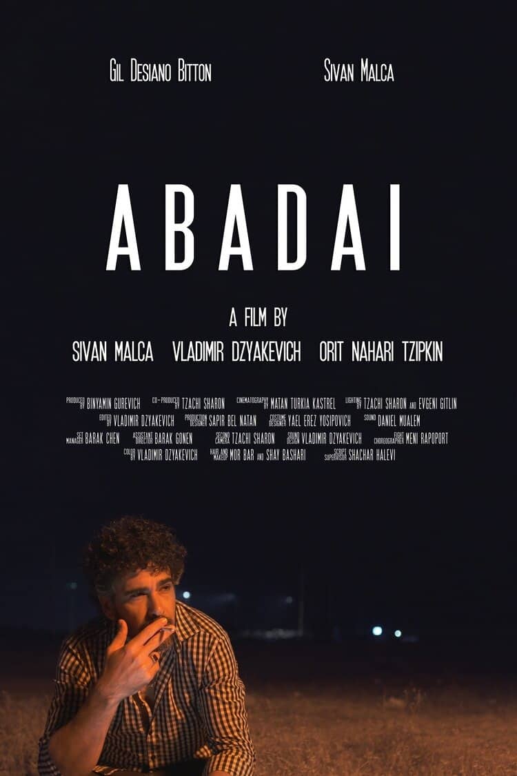 Abadai Poster with man sitting on the side of the road at night