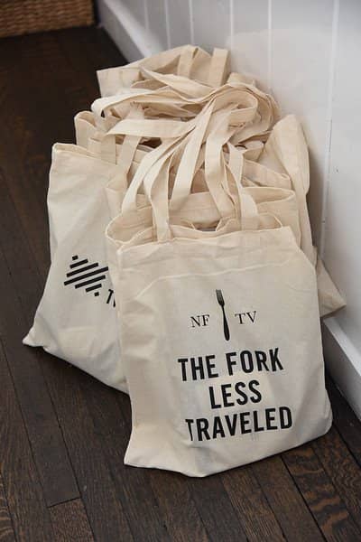 North Fork TV Festival tote bags lined up on floor